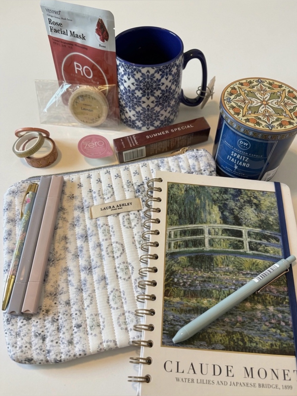 Laura Ashley Quilted Floral Zip Pouch with journal and self care items